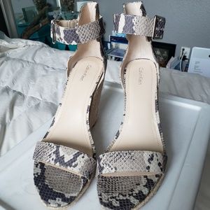 Platform snake print wedges